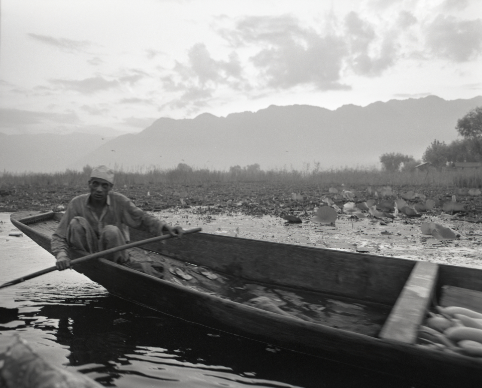 trader on the dal lake, kashmir 1994