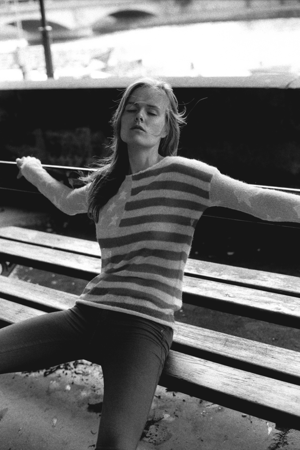 Model Marleen Roosna closing her eyes on a bench photographed by Luigi Cassinelli